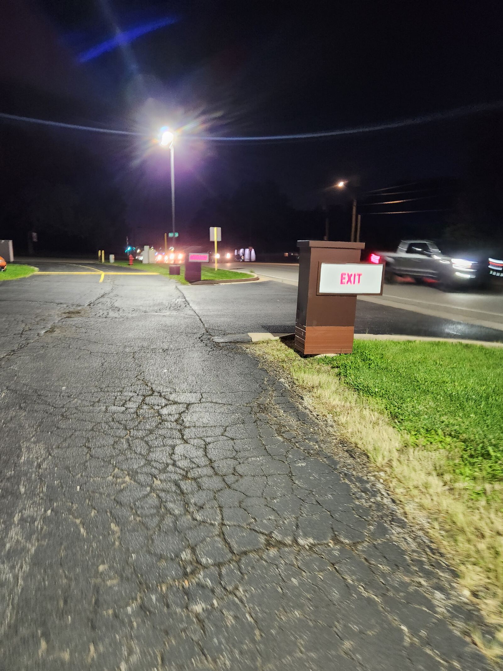 The club’s parking lot along Route 83 at night
